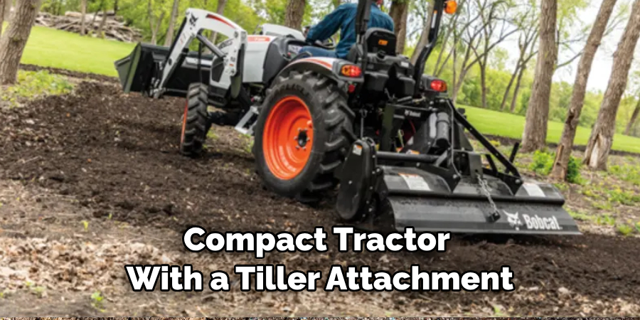 Compact Tractor With a Tiller Attachment