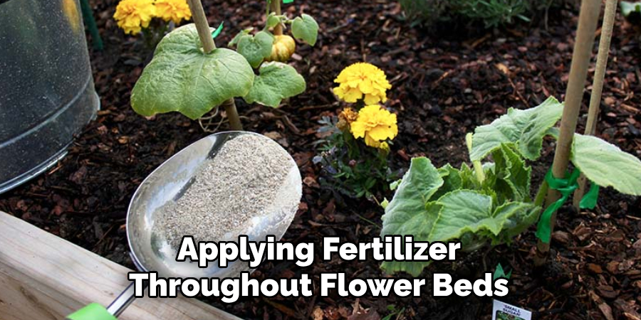 Applying Fertilizer Throughout Flower Beds