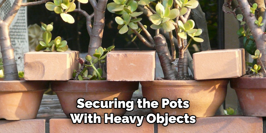 Securing the Pots With Heavy Objects