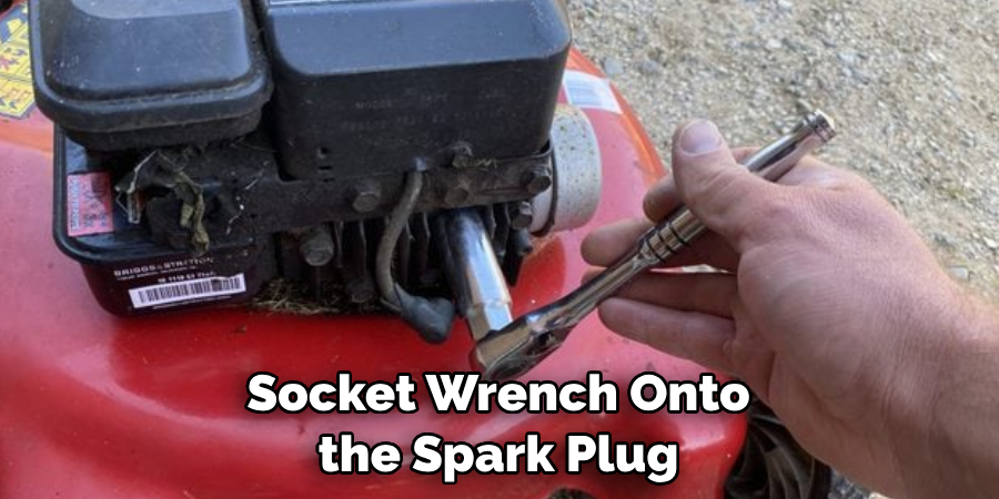  Socket Wrench Onto the Spark Plug